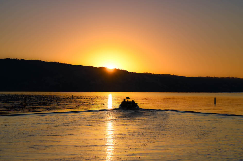 fishing boat on sunrise